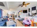 Spacious living room with ceiling fan and an open floorplan at 5706 W Lake Mead Blvd, Las Vegas, NV 89108