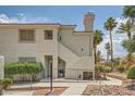 Charming condo featuring a private entrance, neutral stucco, and well-maintained landscaping at 605 Devonhall St # 201, Las Vegas, NV 89145