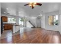 Spacious living area with hardwood floors and access to a staircase at 6325 Orions Tool St, North Las Vegas, NV 89031