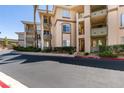 Attractive condo building with well-maintained landscaping and convenient parking at 7151 S Durango Dr # 211, Las Vegas, NV 89113