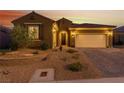Attractive single-story home featuring desert landscaping, and a spacious two-car garage at 977 Majestic Vw, Mesquite, NV 89034