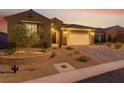 Beautiful single-story home with desert landscaping, retaining wall, and spacious two-car garage at 977 Majestic Vw, Mesquite, NV 89034