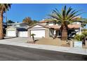 Inviting two-story home with mature landscaping, a two-car garage, and a separate garage at , Henderson, NV 89014