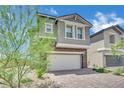 Charming two-story home with stone accents and a brick driveway at 10345 Zebra Swallowtail St, Las Vegas, NV 89141