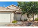 Inviting entrance with decorative accents and desert landscaping, enhancing curb appeal at 1079 Oak Shade Ln, Henderson, NV 89015