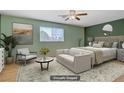 Stylish bedroom features light green walls, contemporary furnishings, and ample natural light at 1305 Chaparral Summit Dr, Las Vegas, NV 89117