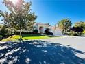 Charming single-story home featuring a well-maintained lawn and mature trees at 2017 Eagle Trace Way, Las Vegas, NV 89117