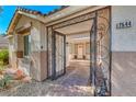 Home entrance featuring an ornate security gate and stamped concrete pathway at 2544 Ashley Rose Ter, Henderson, NV 89052