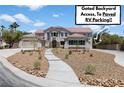 Charming two-story home featuring low maintenance landscaping and RV parking at 276 Glenridding St, Las Vegas, NV 89183