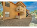 The building has exterior balconies and outside stairways with rock ground cover at 3135 S Mojave Rd # 113, Las Vegas, NV 89121