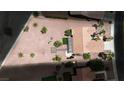 Aerial view of the property showcasing its desert landscaping, tile roof, and patio area at 3157 Faiss Dr, Las Vegas, NV 89134