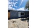 Charming single-story home with a freshly painted grey exterior and a white door at 324 Princeton St, Las Vegas, NV 89107