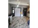 Spacious living room featuring elegant marble floors and neutral color palette at 324 Princeton St, Las Vegas, NV 89107