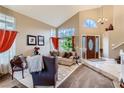 Bright living room with lots of natural light, high ceilings, and views of the front door at 3355 Royal Bay Dr, Las Vegas, NV 89117