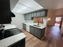 Renovated kitchen featuring wood floors and quartz countertops and updated appliances at 3585 Arville St # 403A, Las Vegas, NV 89103