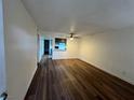 Spacious living room featuring wood floors, neutral walls and updated ceiling fan at 3585 Arville St # 403A, Las Vegas, NV 89103