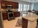 Kitchen with stainless steel appliances, granite counters, and a breakfast bar with seating at 3720 Rocklin Peak Ave, North Las Vegas, NV 89081