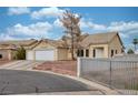 Charming single-story home with a three-car garage, low-maintenance landscaping, and fenced front yard at 4878 Califa Dr, Las Vegas, NV 89122
