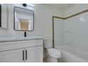 Bright bathroom featuring a modern vanity, framed mirror, and tiled shower-tub combination at 5330 E Charleston Blvd # 2, Las Vegas, NV 89142