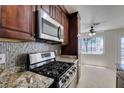 Updated kitchen featuring granite countertops, stainless steel appliances, and a gas range for cooking at 5330 E Charleston Blvd # 2, Las Vegas, NV 89142