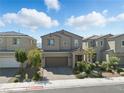 Charming two-story home featuring a brick-paved driveway and beautifully landscaped front yard at 6322 Angora Peak Ln, Las Vegas, NV 89115