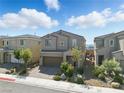 Charming two-story home featuring a brick-paved driveway and beautifully landscaped front yard at 6322 Angora Peak Ln, Las Vegas, NV 89115