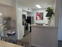 The kitchen has stainless steel appliances, white cabinetry, and plenty of countertop space at 6650 W Warm Springs Rd # 2159, Las Vegas, NV 89118