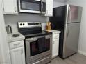 Close up of the kitchen featuring stainless steel appliances, and white cabinets at 6650 W Warm Springs Rd # 2159, Las Vegas, NV 89118