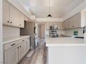 Bright kitchen featuring stainless steel appliances, white countertops, sleek cabinets and modern light fixtures at 8000 Vista Twilight Dr, Las Vegas, NV 89123