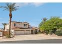Spacious two-story home featuring a three-car garage, tile roof, and mature palm trees at 8104 Wispy Sage Way, Las Vegas, NV 89149