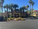 A view of the community clubhouse featuring desert landscaping and ample parking at , Las Vegas, NV 89183