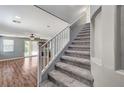 Carpeted staircase leading to the upper level, complemented by gray walls and white trim at 10805 Cain Ave, Las Vegas, NV 89166