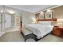 Well-appointed bedroom features a king bed, ensuite bathroom, and comfortable seating at 135 E Harmon Ave # 315, Las Vegas, NV 89109