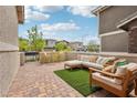 Cozy outdoor patio featuring comfortable seating and a small bar area for entertaining guests at 160 Lilt Ave, Henderson, NV 89011
