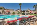 Relaxing backyard featuring a sparkling pool, gazebo and lounge chairs for the ultimate outdoor enjoyment and entertaining at 1701 Drifters Peak St, Las Vegas, NV 89144
