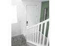 Bright staircase featuring white railings and a clean design with an open view at 1703 Game Garden Rd, North Las Vegas, NV 89031