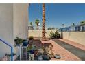 Exterior view showcasing desert landscaping with crushed rock, various cacti and other native plants at 2725 S Nellis Blvd # 1038, Las Vegas, NV 89121