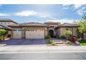 Charming single-story home featuring a three-car garage and manicured front yard at 2896 Grande Arch St, Henderson, NV 89044