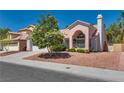 Charming single-Gathering home featuring a tile roof, landscaped yard, and stucco exterior at 2904 Channel Bay Dr, Las Vegas, NV 89128