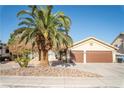 Inviting home with a palm tree, landscaped yard, and a two-car garage, perfect for Gathering living at 3436 N Tenaya Way, Las Vegas, NV 89129