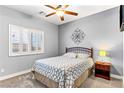 Serene bedroom with neutral walls, carpet, ceiling fan, and plantation shutters at 3811 Queen Elizabeth Ct, Laughlin, NV 89029