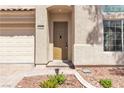 Close-up of the home's front entrance with stone accents and a covered porch at 4016 Owlshead Mountain St, Las Vegas, NV 89129
