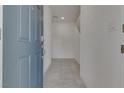 Tiled entryway showing white walls and neutral decor at 4448 Mahogany Hills Ave, Las Vegas, NV 89141