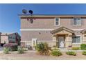 Charming townhome showcasing desert landscaping and a welcoming front entrance at 5552 Dueces Wild Ct # 101, Las Vegas, NV 89122