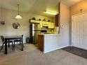 Compact kitchen featuring modern appliances and an eat-in bar at 5750 E Hacienda Ave # 107, Las Vegas, NV 89122