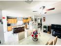 Open-concept kitchen and dining area featuring a breakfast bar and modern appliances at 8156 Blue Hope Diamond Ln, Las Vegas, NV 89139