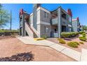 Well-maintained apartment complex with neat landscaping and exterior stairs leading to upper units at 8600 W Charleston Blvd # 2187, Las Vegas, NV 89117