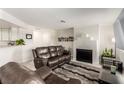 Inviting living room with modern fireplace, comfortable seating, and open concept layout at 8600 W Charleston Blvd # 2187, Las Vegas, NV 89117