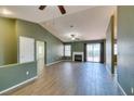 Spacious living room featuring vaulted ceiling, fireplace, tile floors and sliding glass doors at 904 Big Horn St, Henderson, NV 89002