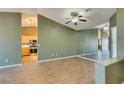 Open concept living room with tile floors that flows seamlessly to the kitchen at 904 Big Horn St, Henderson, NV 89002